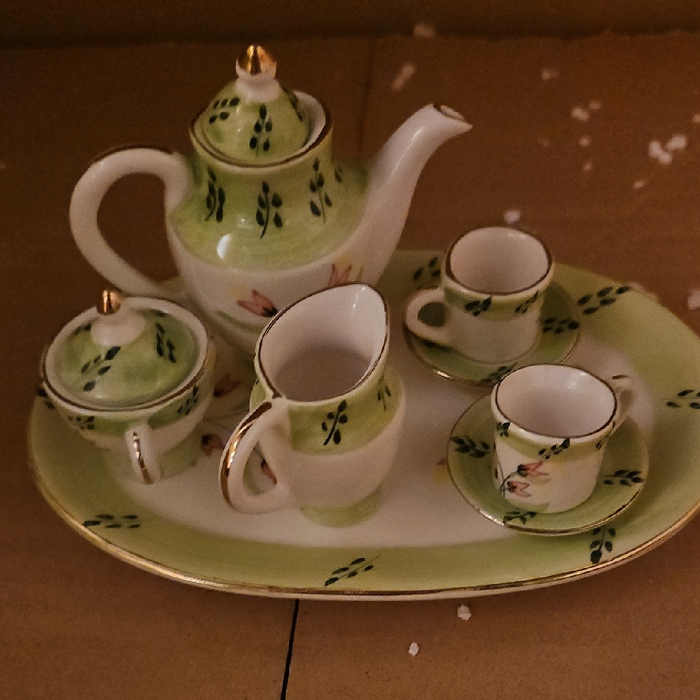 Green and White Tea Set with Gold Accents